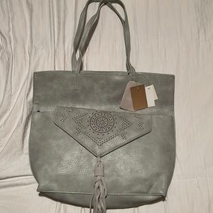 Brand new tote that comes with matching clutch. Real suede and reversible